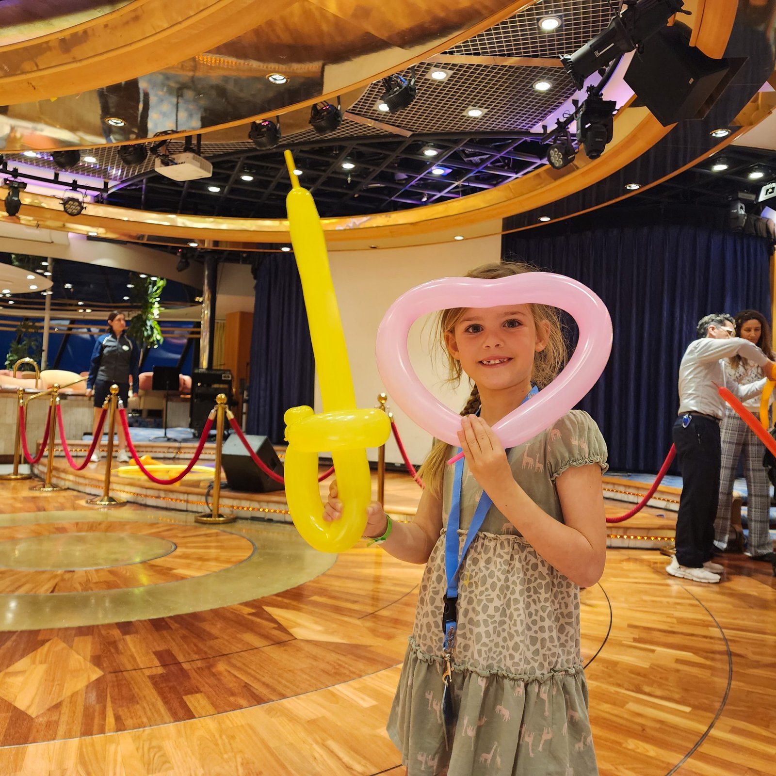 Young girl showing her new skills of balloon twisting