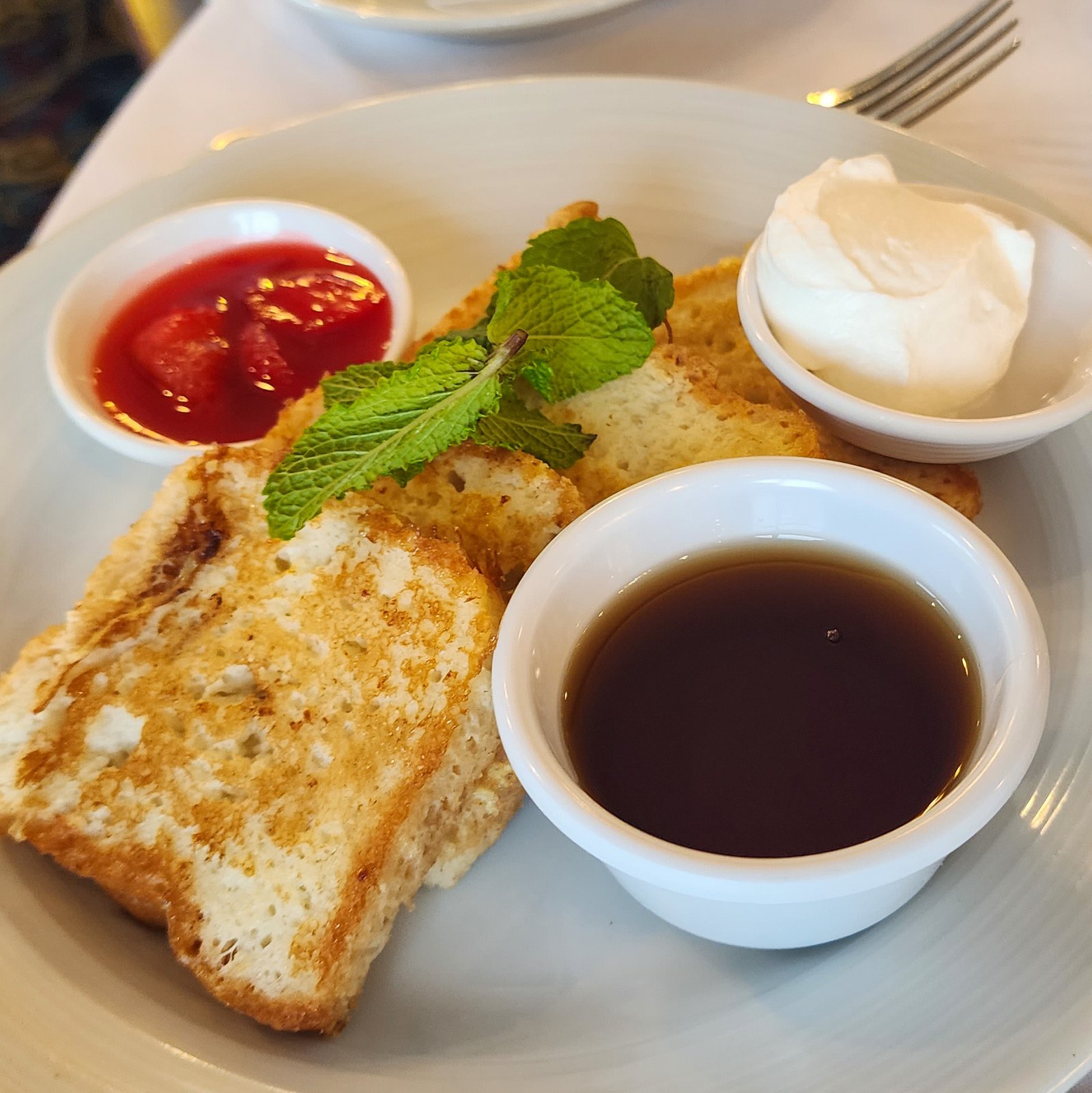 Gluten free french toast with maple syrup, ice-cream and strawberry compote