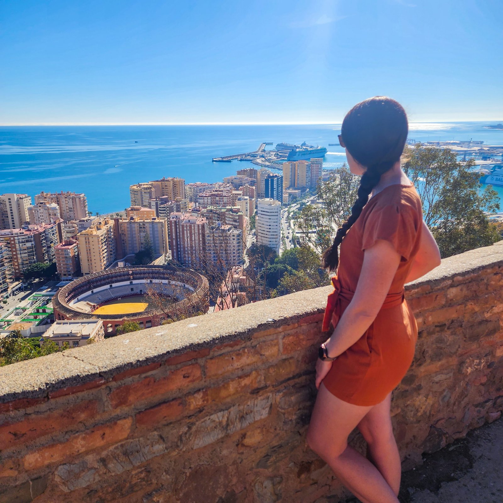 Woman standing looking out at the view over Malaga from the city lookout
